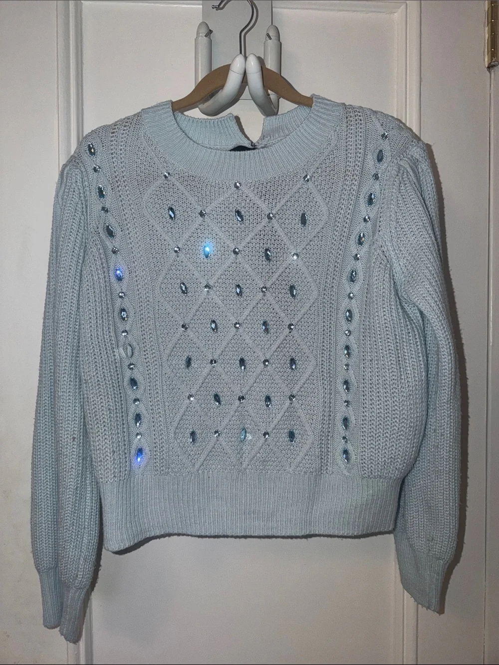 Elegant Light Blue Knit Sweater with Embellishments
